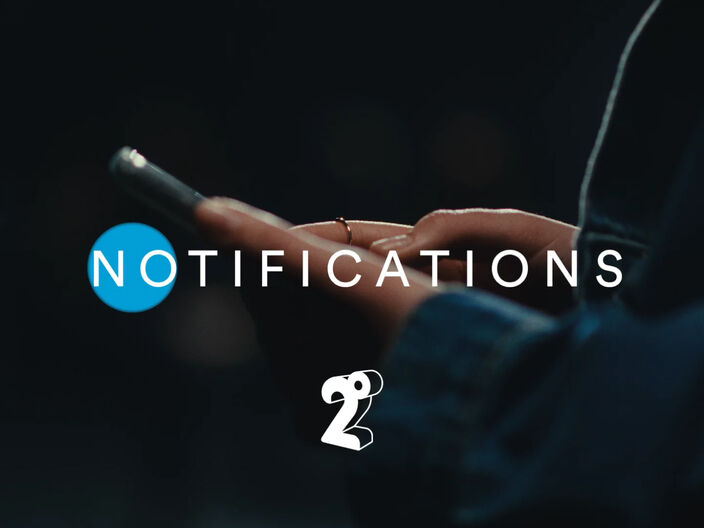 picture of a womans hands holding a mobile phone with the title 'notifications' overlaying the image